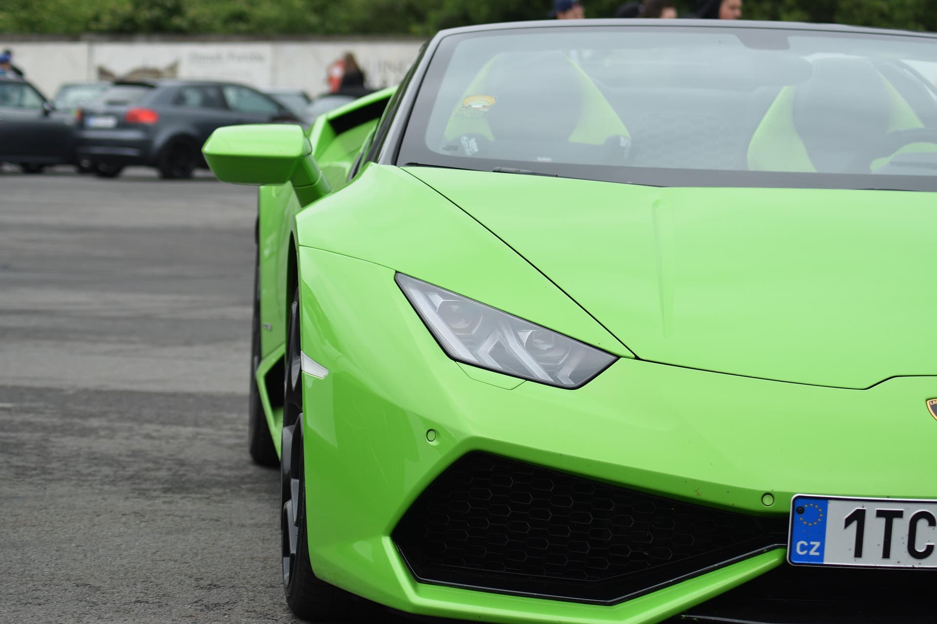 Verde Mantis green Lamborghini Huracán Spyder front end filling the frame at a car meet